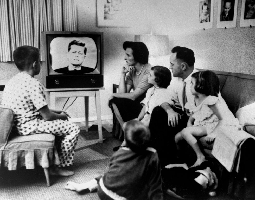 A family gathered around the TV while watching the Kennedy-Nixon debate