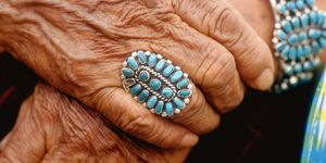 closeup of beautifully weathered hands of navajo woman modeling turquoise bracelet  ring made by native americans  photo by michael mauneythe life picture collection via getty images
