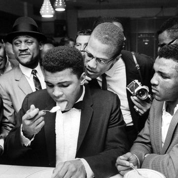 muhammad ali and malcolm x at a crowded counter