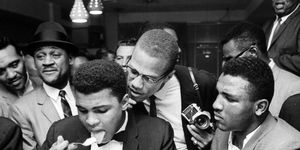 muhammad ali and malcolm x at a crowded counter
