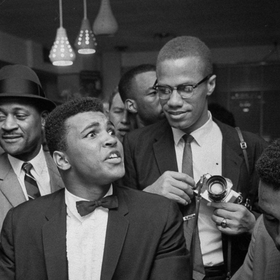 miami   march 1964 black muslim leader malcolm x 2r, teasingly leaning on shoulder of tux clad cassius clay now muhammad ali l, who is sitting smugly at soda fountain counter, surrounded by jubilant fans after he beat sonny liston for the heavyweight championship of the world  photo by bob gomelthe life images collection via getty imagesgetty images