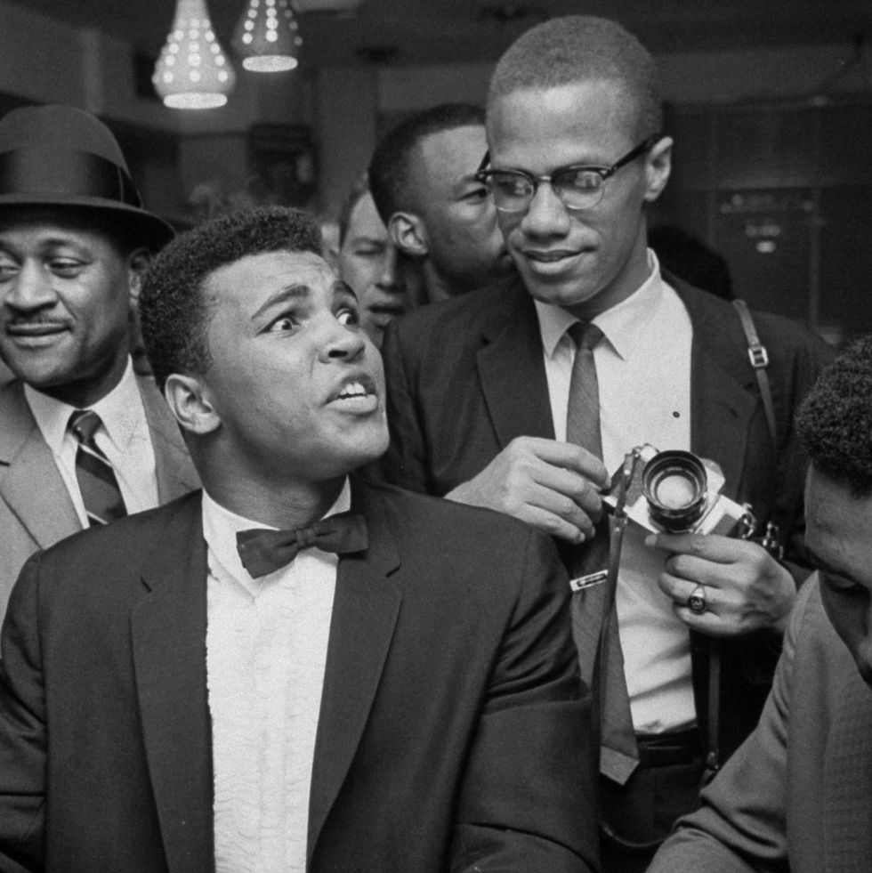 miami   march 1964 black muslim leader malcolm x 2r, teasingly leaning on shoulder of tux clad cassius clay now muhammad ali l, who is sitting smugly at soda fountain counter, surrounded by jubilant fans after he beat sonny liston for the heavyweight championship of the world  photo by bob gomelthe life images collection via getty imagesgetty images