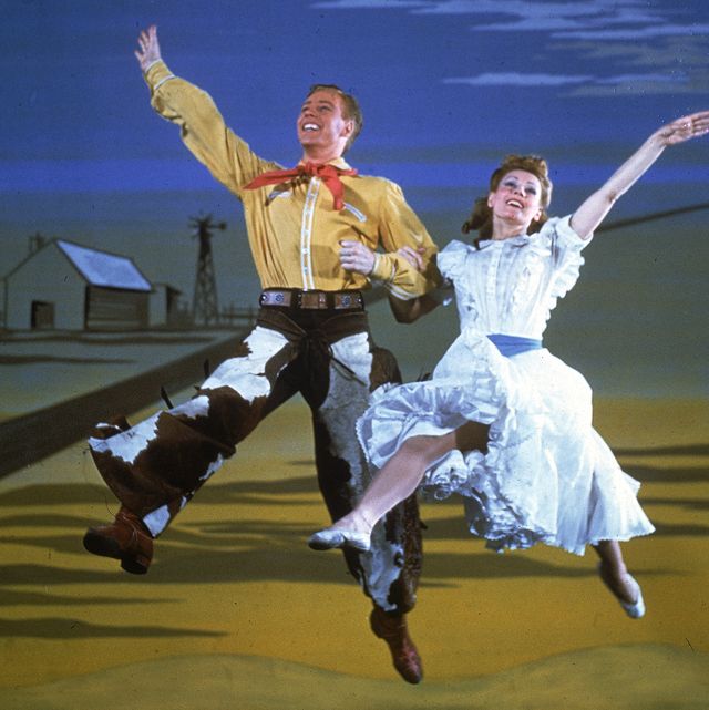 American actor Marc Platt and Russian-born actress Katherine Sergava dance together in a scene from the Broadway musical 'Oklahoma!' at the St. James Theatre, New York, New York, 1943