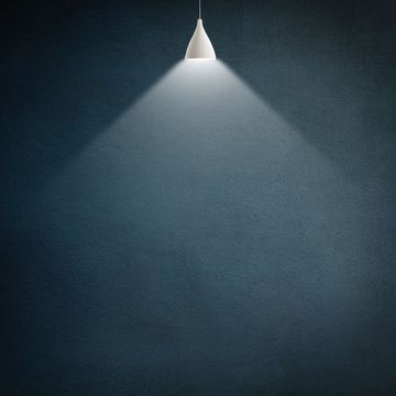 illustration of a lamp illuminating a dark empty room