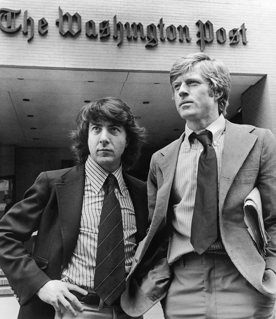 1976, promotional portrait of robert redford, right, and dustin hoffman standing in front of the washington post building in a still from director alan j pakulas film all the presidents men the actors portrayed post reporters bob woodward and carl bernstein, who were the first to investigate the watergate scandal photo by warner brosgetty images