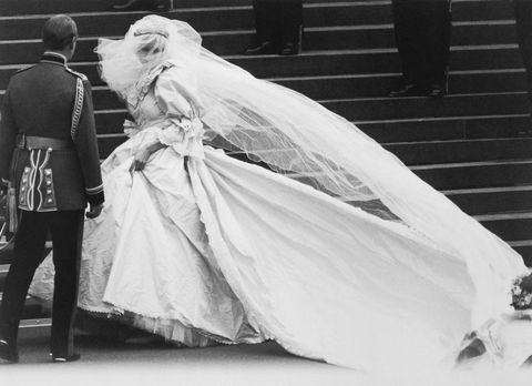 lady diana spencer arrives at st paul's cathedral on her wedding day, revealing to the world the wedding dress which had been carefully guarded during its design