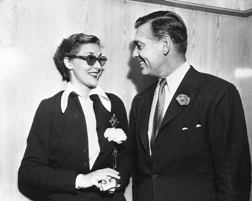 original caption 791948 new york, ny parting is such sweet sorrow one of the outward bound passengers on the ss queen mary today was clark gable, handsome star of the movies, who is shown chatting with mrs howard hawks just before sailing time she is the former wife of the movie tycoon and she and gable have been seen around and about more frequently than is customary for purely platonic friends so who knows perchance mayhap the big ship was held up 18 minutes while they said goodbye