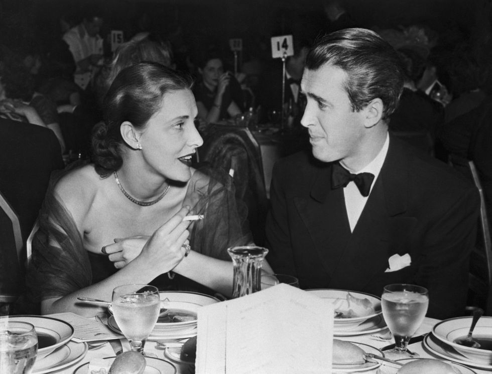 original caption 4131948 new york, ny suppering at the waldorf, mrs howard hawks, wife of the movie mogul and one of the countrys best dressed women, chats with jimmy stewart, stage and screen star, at a recent supper party at the waldorf astoria
