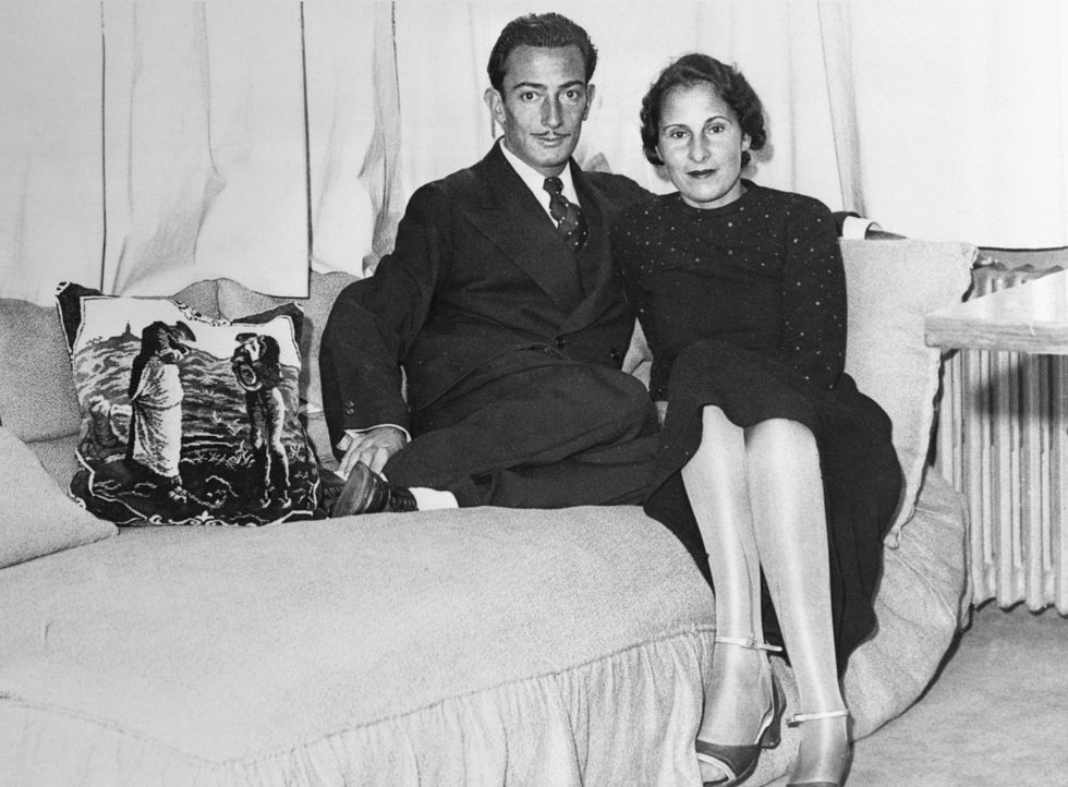 Salvador Dali and lifelong love Gala in Dali's Paris studio in 1934. Gala was married to poet Paul Eluard when this photograph was taken. After meeting in 1929, Dali finally persuaded Gala to marry him in 1958.