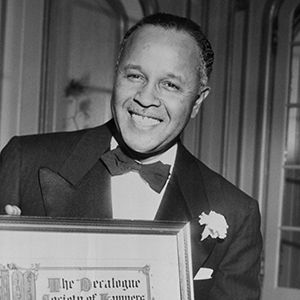 percy julian in a tuxedo smiling at the camera