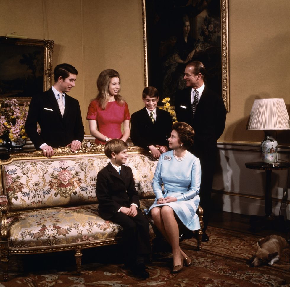 original caption london, england queen elizabeth and prince philip with their four children, prince charles, princess anne, prince andrew, and prince edward, seated in a living room in buckingham palace