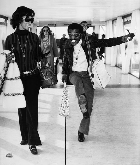 a jubilant sammy davis jr dances near his wife altovise gore davis at heathrow airport as they prepare to return to los angeles after a three week holiday in europe