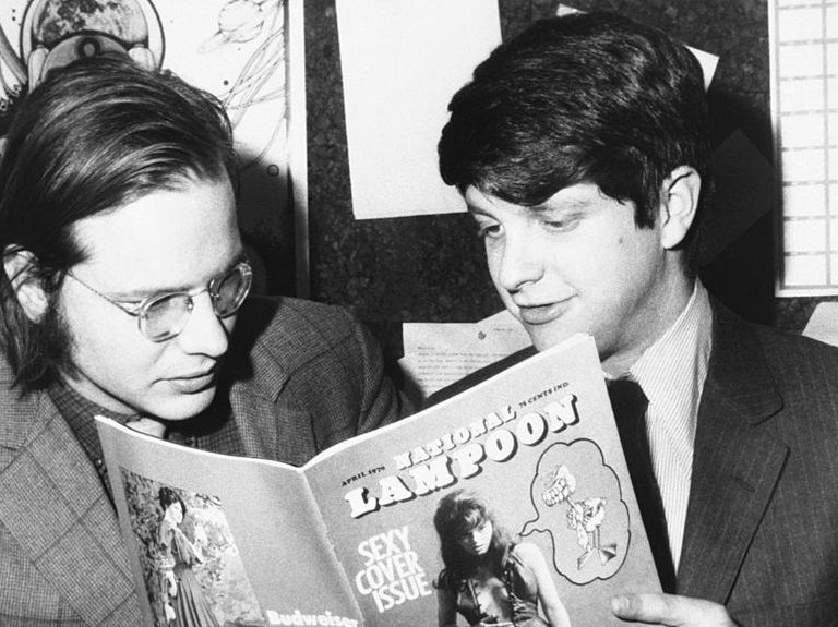 robert hoffman, managing editor, and douglas c kenney, editor, look over the first copy of national lampoon   a monthly humor magazine with each issue treating a separate topic with the satirical style of the famous university magazine it parodies