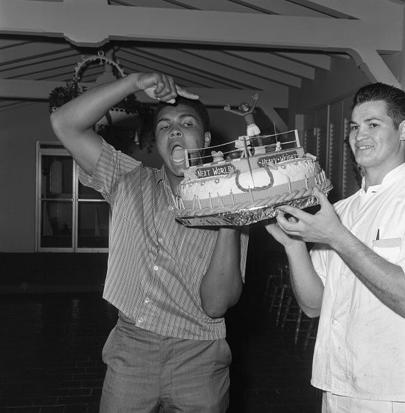 vintage birthday photos cassius clay points to the winner with the quote, its me you see. the occasion was a birthday party marking clays 22nd birthday, with a cake in the form of a boxing ring.