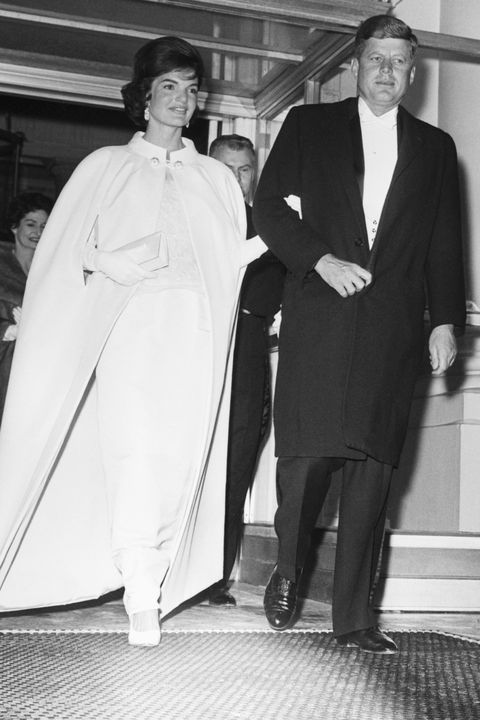 original caption 1201961 washington, dc full length shot of president and mrs john f kennedy as they left the white house to attend a series of inaugural balls five locations were booked to hold the tremendous crowd that wanted to attend the first ladys dress was designed by oleg cassini