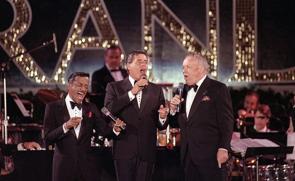original caption 1081987 atlantic city, nj   sammy davis jr, jerry lewis, and frank sinatra get together for a performance as they help kickoff opening ceremonies for the renaming of the golden nugget hotel to bally's grand hotel the three sang several numbers and helped flip a huge switch to light on the new name plate atop the hotel