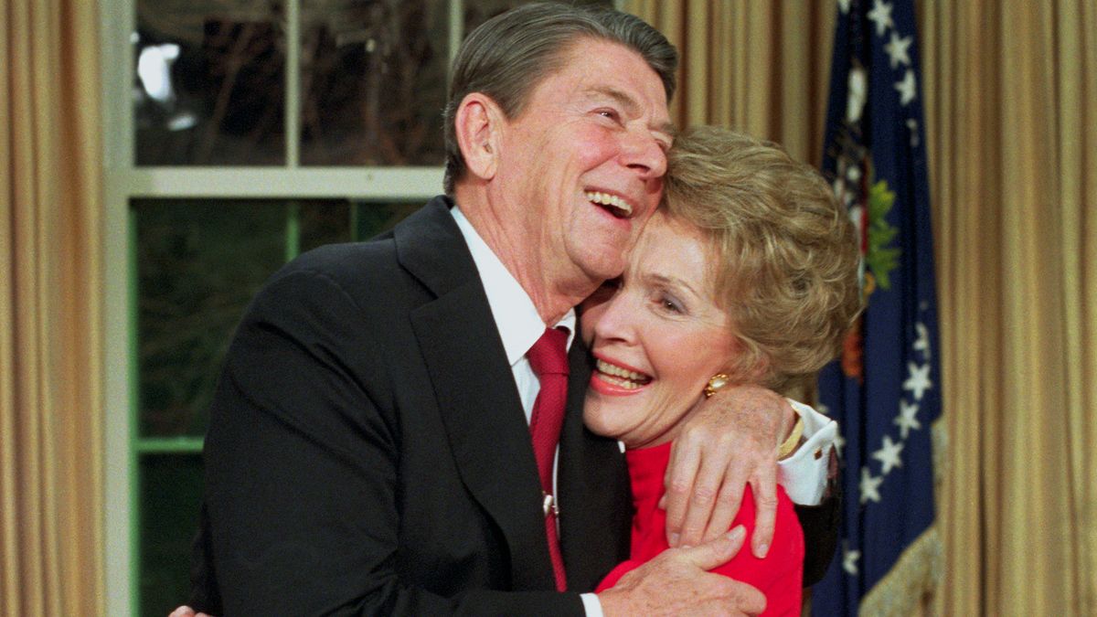 Ronald Reagan hugs his wife Nancy in the Oval Office