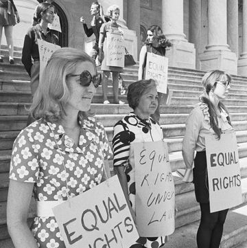 original caption 1071970  washington, dc  with signs hanging around their necks calling for equal rights under law, a group of women took up a vigil on the capital steps as the senate got off to a slow start on consideration of proposed constitutional amendment on womens rights in foreground, left to right, are crances kolb, flora crater and dana kline
