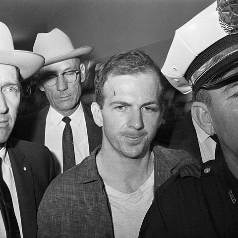 original caption twenty four year old ex marine lee harvey oswald is shown after his arrest here on november 22 he received a cut on his forehead and blackened left eye in scuffle with officers who arrested him oswald, an avowed marxist, has been charged with the murder of president john f kennedy, who was killed by a sniper bullet as he rode in motorcade through dallas