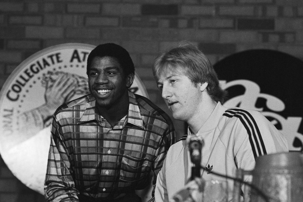 michigan state guard earvin johnson and indiana state forward larry bird answer questions for reporters during a press conference in salt lake city, utah tomorrow, the two players will face off when their teams meet in the ncaa final four championship, a game many feel will be a classic matchup of two collegiate superstars