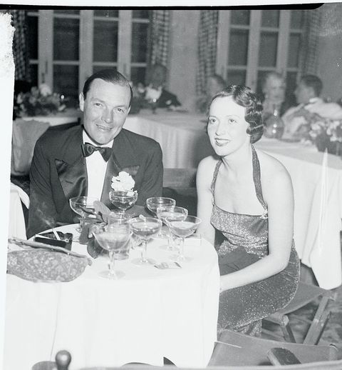 Mr. and Mrs. Stephen Sanford Sitting at a Table