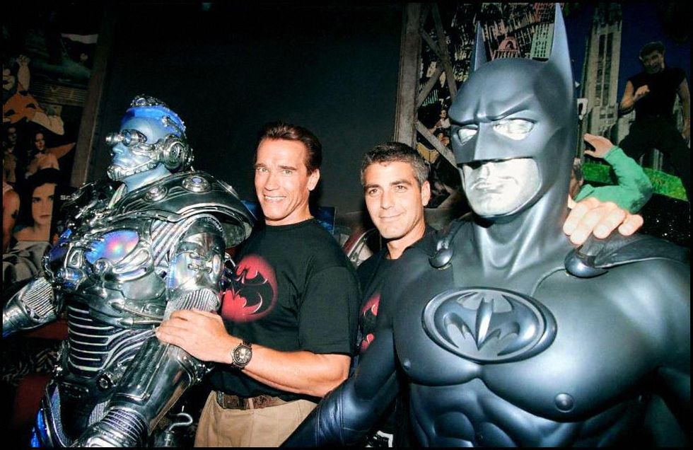 beverly hills, united states  the stars of the film batman  robin, actors arnold schwarzenegger l and george clooney r pose with their costumes mr freeze and batman 06 june at planet hollywood in beverly hills, where the costumes will be on permanent display  schwarzenegger, who plays mr freeze, recently had heart surgery photo credit should read mike nelsonafp via getty images