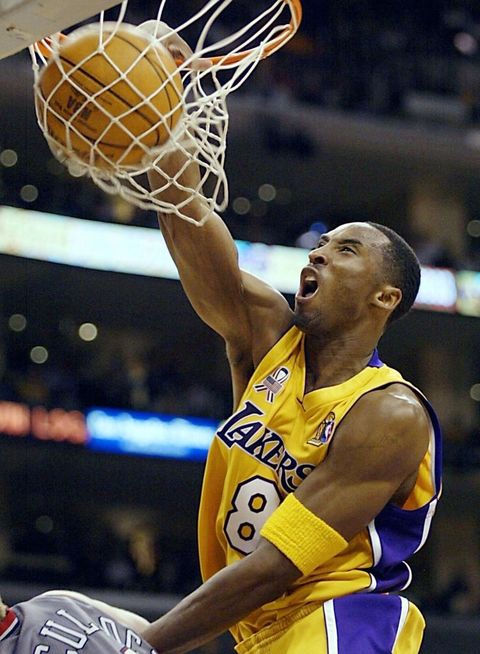 los angeles, united states  kobe bryant of the los angeles lakers dunks the ball against the new jersey nets in the 3rd quarter of game one of the nba finals against 05 june 2002, at the staples center in los angeles, ca the lakers are defending champions and are looking to win their third championship in a row  afp photo jeff haynes photo credit should read jeff haynesafp via getty images