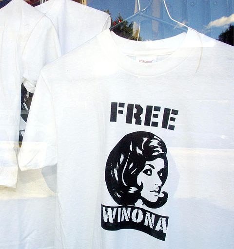 hollywood, united states  on display in a los angeles store window is a "free winona" tee shirt r and a john walker lindh "holiday in afghanistan" tee shirt 29 january 2002  winona ryder has been charged with shoplifting and will be arraigned in los angeles criminal court in february  john walker lindh, the us national accused of fighting for the taliban and al qaeda, is being held by federal authorities in alexandria, va following his first court appearance last week   afp photo  mike nelson photo credit should read mike nelsonafp via getty images