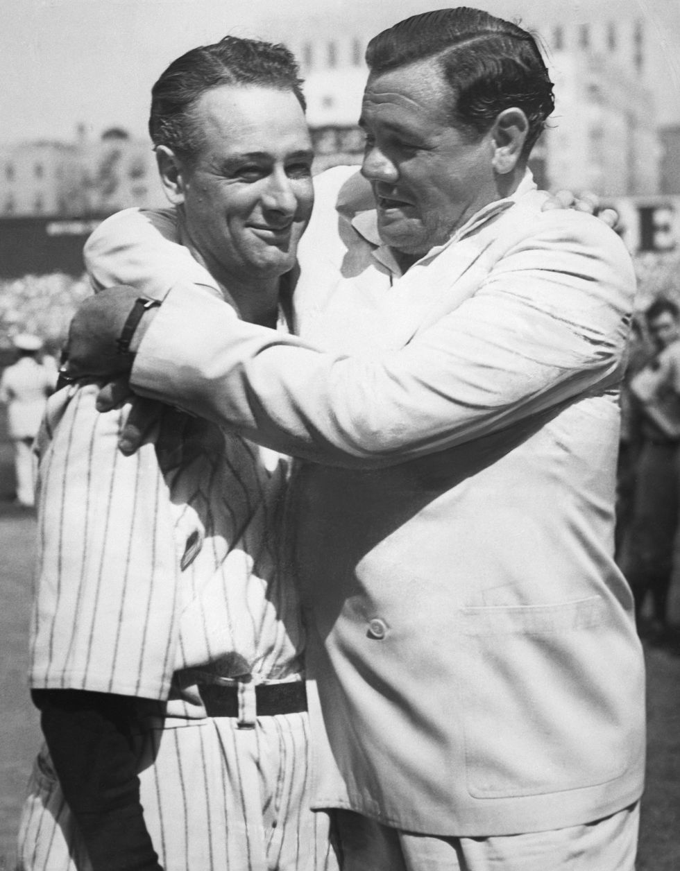 Babe Ruth greets his former teammate Lou Gehrig on the occasion of "Lou Gehrig Day" at Yankee Stadium, during a ceremony honoring the non-playing Captain of the Yankees, whose playing days have ended as a result of a diseased spine. The ceremony took place in between games of the New York Yankees-Washington Senators double header.