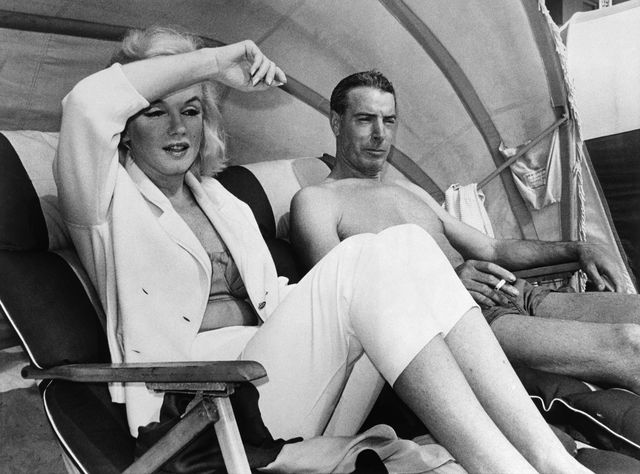 Marilyn Monroe and Joe DiMaggio relaxing in a cabana on Redington Beach, Florida on March 22, 1961