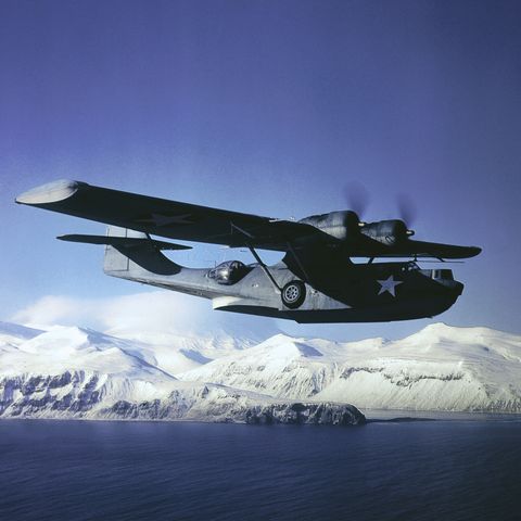 original caption pby 5a catalina bomber on patrol over uninhabited aleutian wastes in one of rare clear days in that section