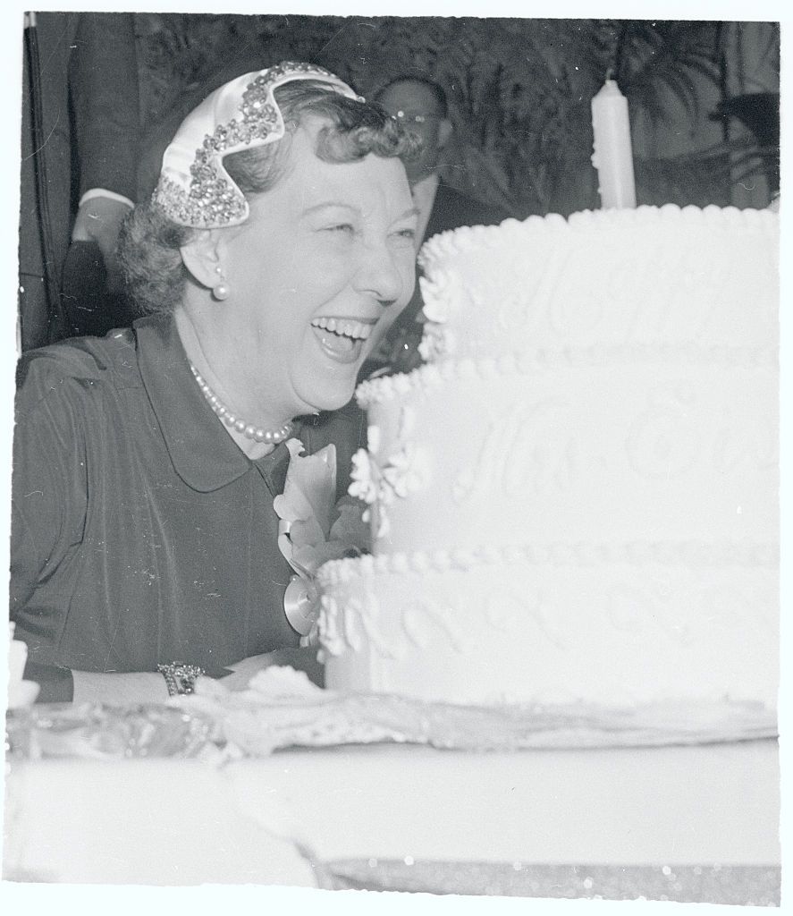 original caption the camera angle makes it seem as if mrs dwight eisenhower is about to get a mouthful of cake as she lets go with a hearty chuckle during a birthday party given to her by the league of republican women in washington dispenser of the chuckles is comedian red skeleton the lone candle on the cake represents 58 years the presidents wife will be 58 november 14