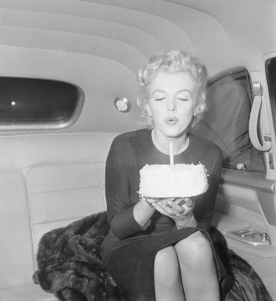 vintage birthday photos marilyn monroe blowing out candle on 30th birthday cake