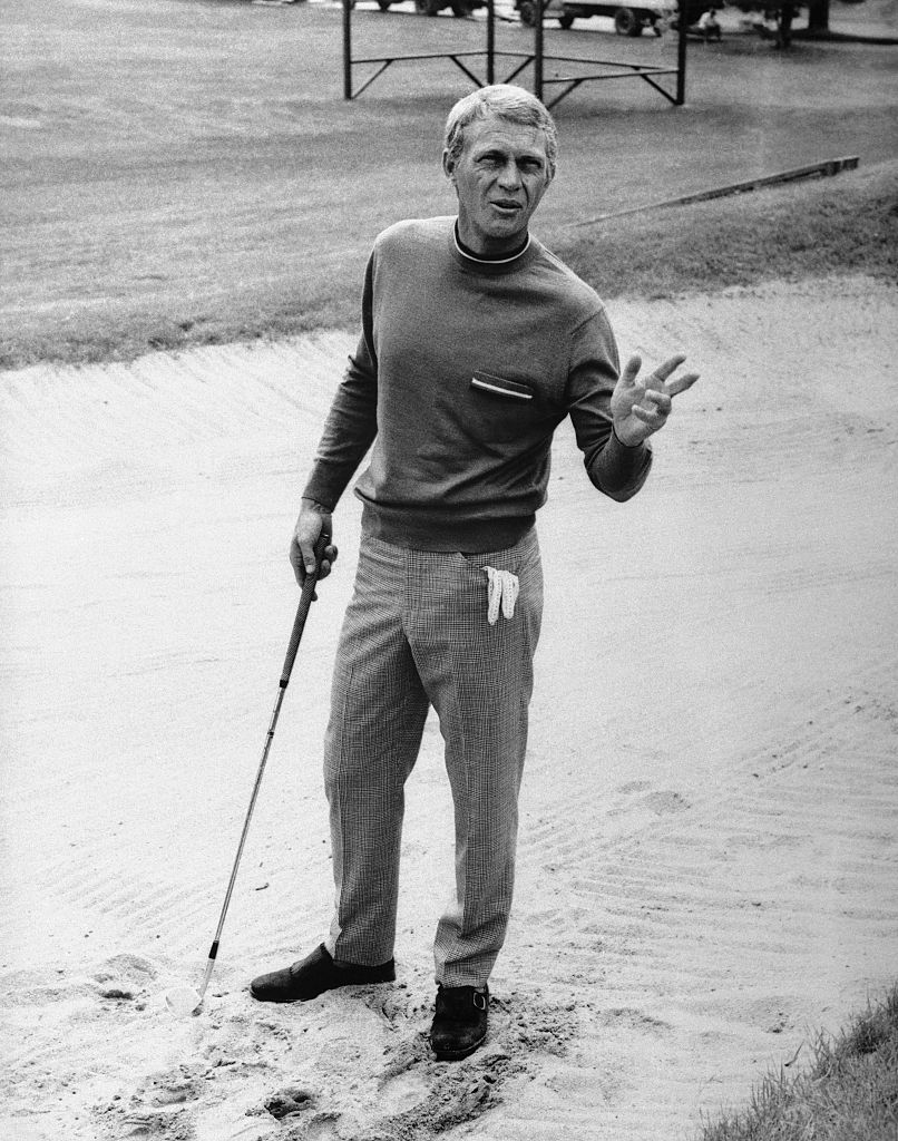 original caption multimillionaire thomas crown, played by steve mcqueen, bets his opponent double or nothing that he can make a hole in one from this sand trap in which the ball has been buried he fails and loses $2,000