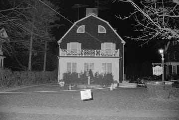 a house at night is lit up from the outside