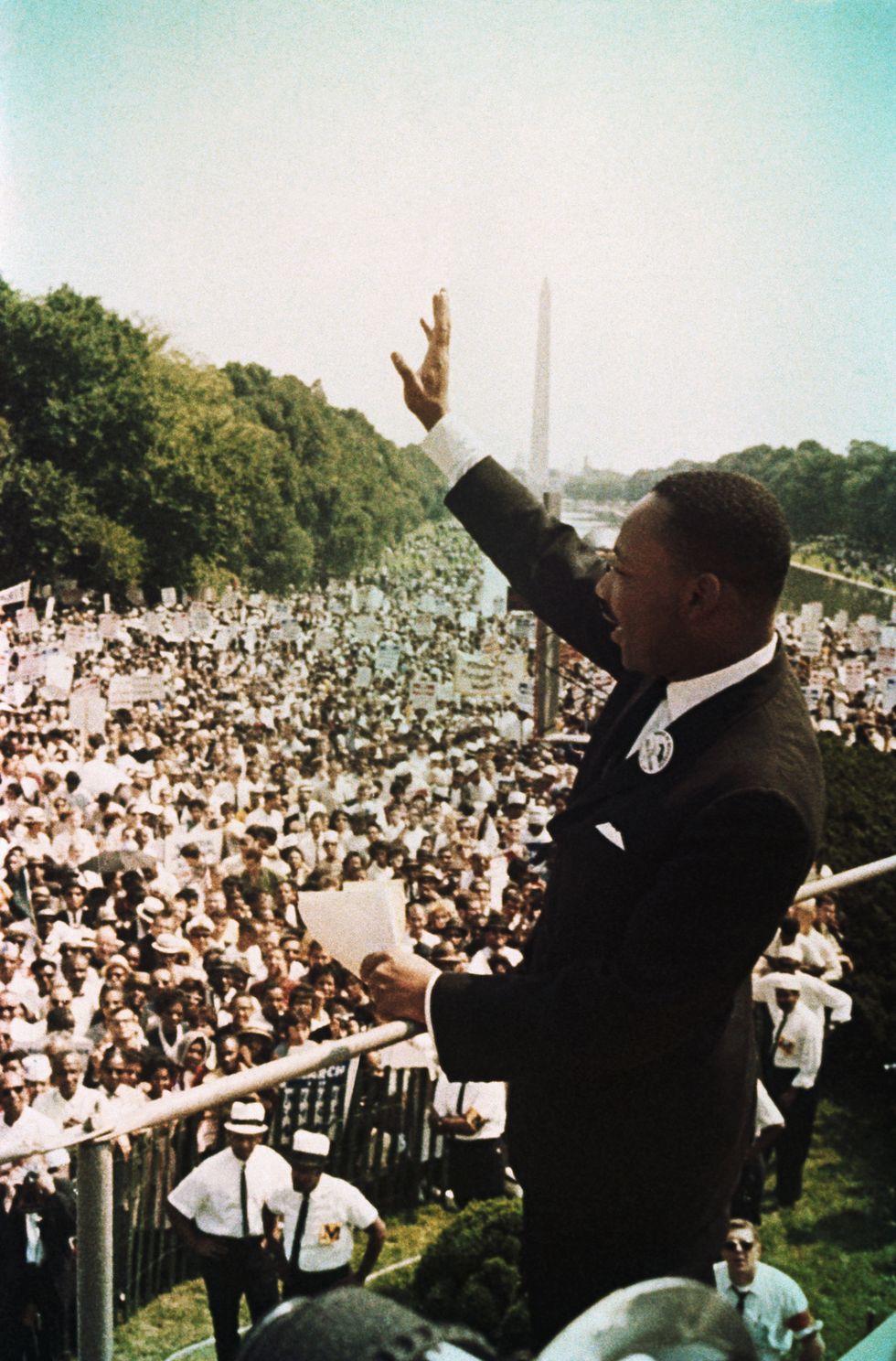 Martin Luther King Jr. waves to participants at the March on Washington on August 28, 1963