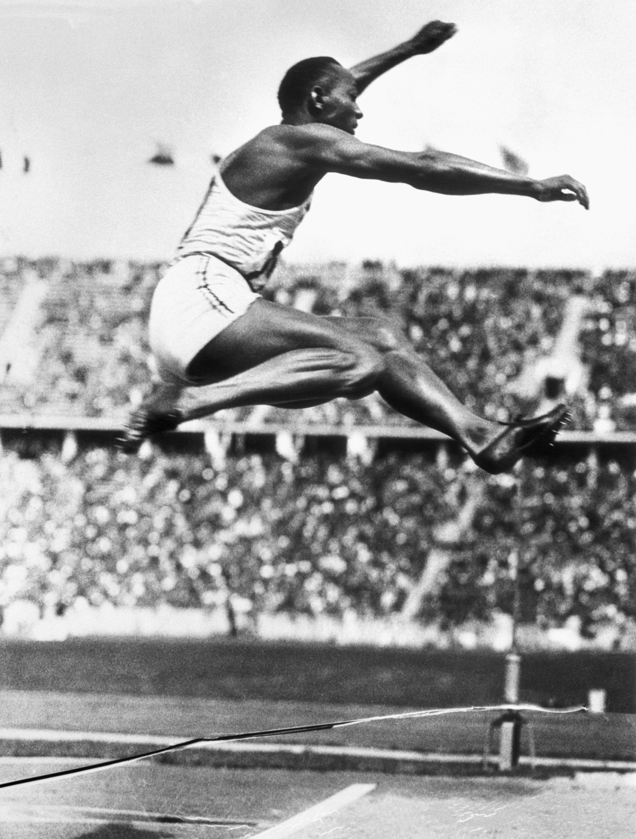 american track athlete jesse owens makes the long jump that set an olympic record in berlin at the 1936 olympic games his performance at the games in several events was one of the major upsets to german dictator adolf hitlers hopes that german athletes would prove their superiority in athletic endeavors