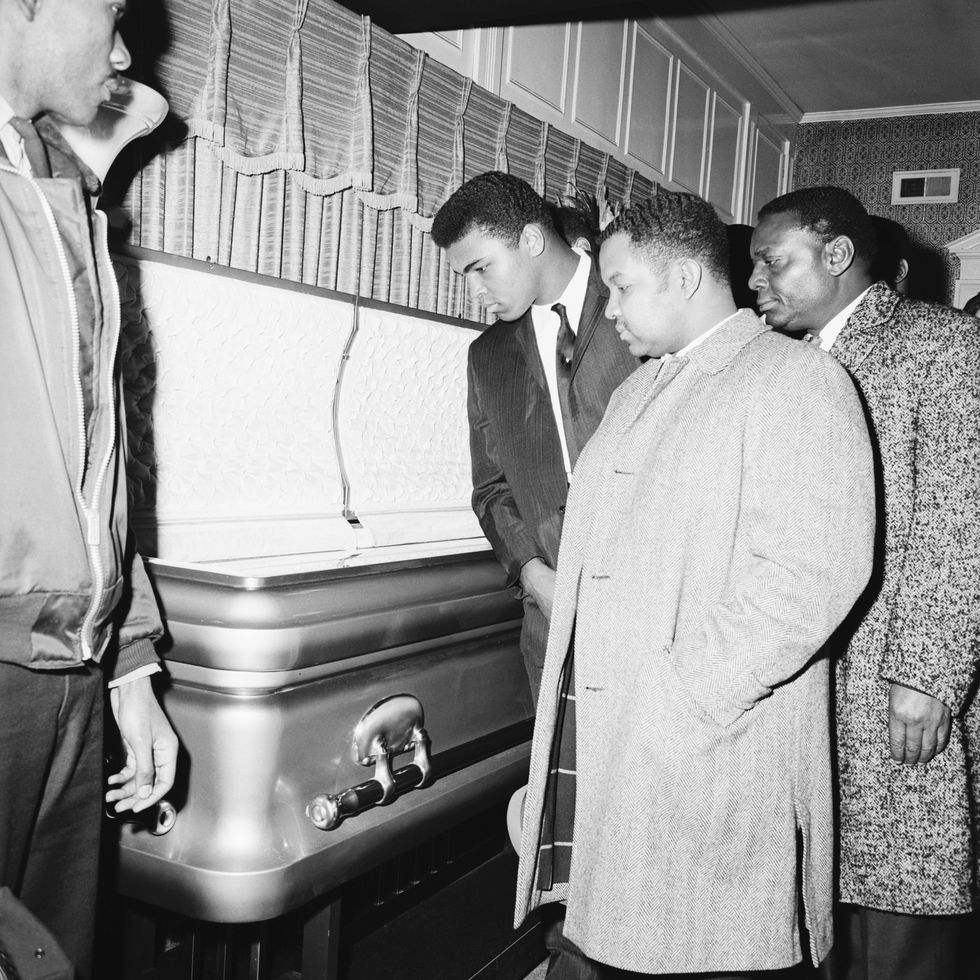 heavyweight boxing champion cassius clay views the body of soul singer sam cooke at his wake in chicago