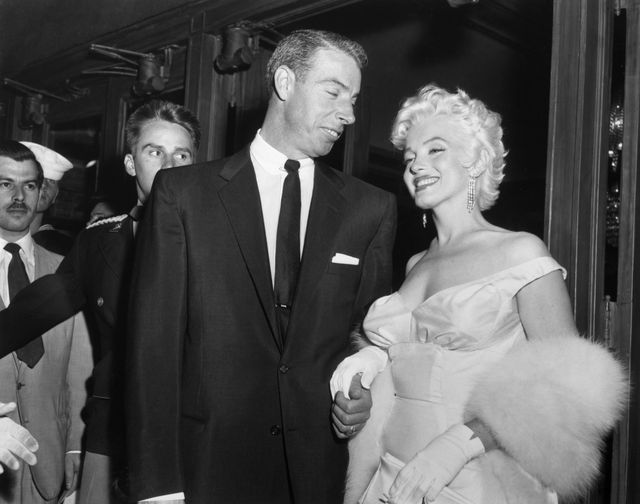 Joe DiMaggio escorts ex-wife Marilyn Monroe to the premiere of her movie "The Seven Year Itch" in June 1955