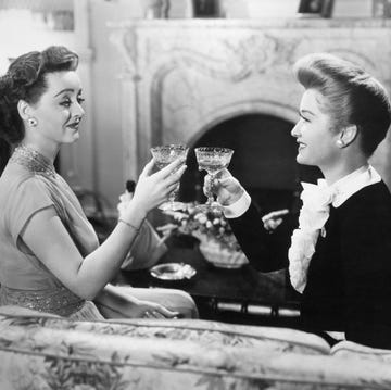 Bette Davis And Miriam Hopkins Toasting original caption a scene from the movie quotthe old acquaintance" with bette davis and miriam hopkins, 1943 copyright vitagraph inc all rights reserved copyright is waived to magazines and newspapers country of origin usa this advertising material is the property of vitagraph inc and is leased pursuant to an agreement which provides the exhibitor agrees that the advertising materials are leased for use only in conjunction with the exhibition at the theater specifiedof the respective motion pictures identified in such materials and only for the purpose of properly advertising and exploiting said respective motion pictures at said theater and the exhibitor agrees that he will not trade, etc