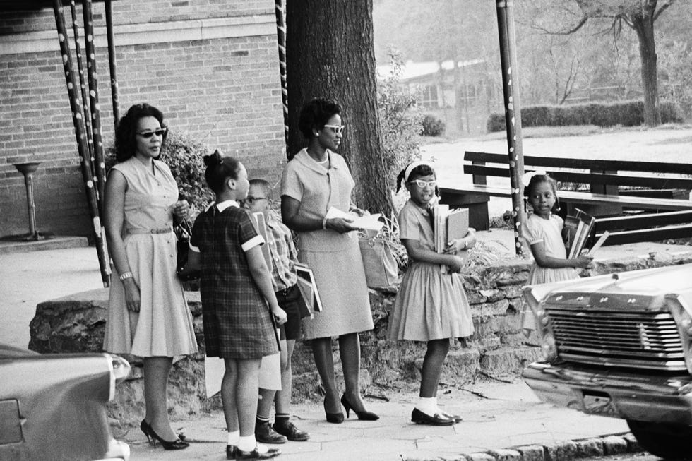 original caption 8301965 atlanta, ga   dr martin luther king, jr, and his top aide, rev ralph abernathy, enrolled five of their children in a previously all white elementary school here 830 arriving to pick them up are mrs king, her two children yolanda and martin luther king iii l, mrs abernathy and her two daughters donzaleigh and juandalynn ralph abernathy ii, who also attended school, was not available for picture