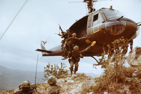 a group of infantrymen from the 1st cavalry division jump from a bell uh 1 iroquois, also known as a "huey", as they begin a reconnaissance mission in vietnam