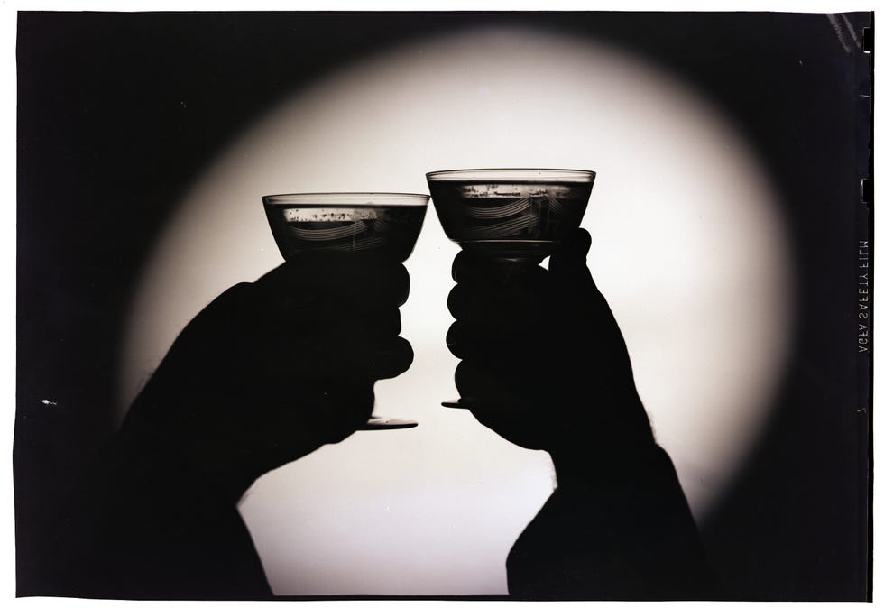 original caption silhouette of two toasting wine glasses undated photograph