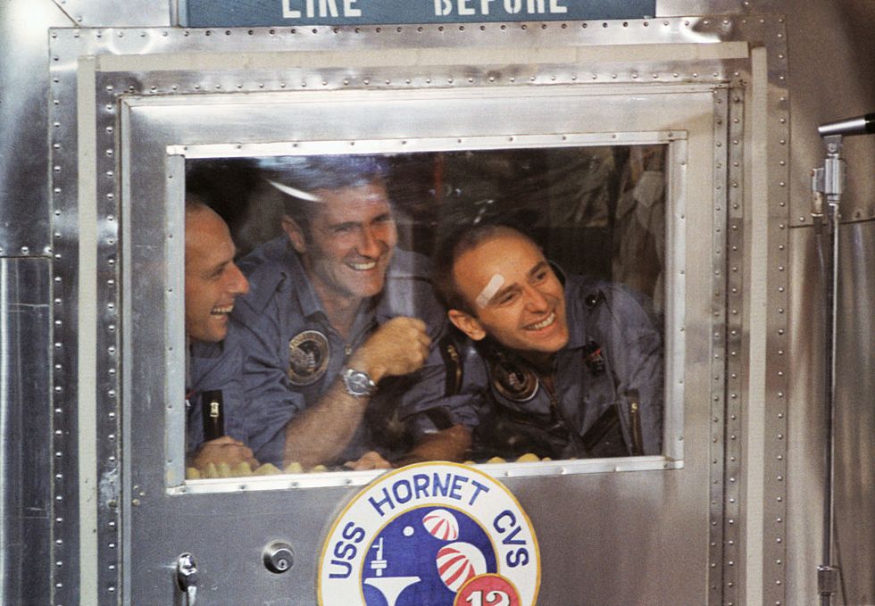 Astronauts Peering from Window