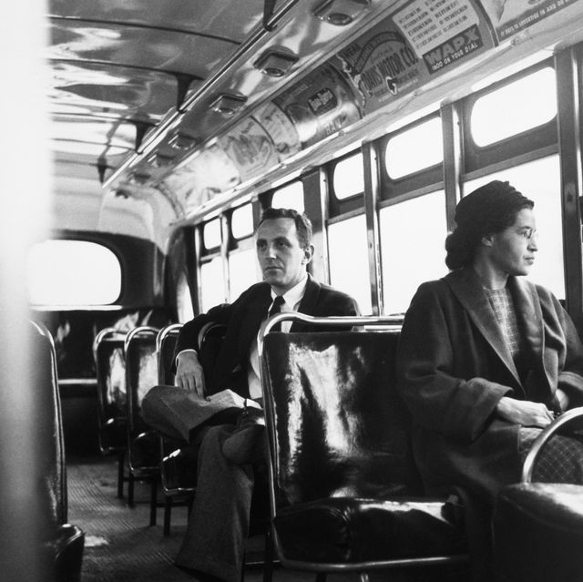 rosa parks sits in the front of a bus in montgomery, alabama, after the supreme court ruled segregation illegal on the city bus system on december 21, 1956