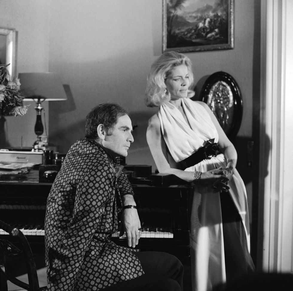 italian born fashion designer pierre cardin seated and american actress lauren bacall pose near a piano for the cbs special the paris collections fall fashion preview, june 26, 1968 photo by cbs photo archivegetty images