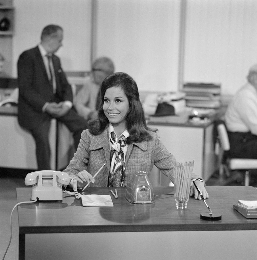 american actress mary tyler moore as mary richards sits at her new desk and sharpens pencils in an electric sharpener after being hired in the newsroom of television station wjm in a scene from the love is all around episode of the mary tyler moore show also known as mary tyler moore, los angeles, california, july 30, 1970 the episode, the debut episode of the show, originally aired on september 15, 1970 photo by cbs photo archivegetty images