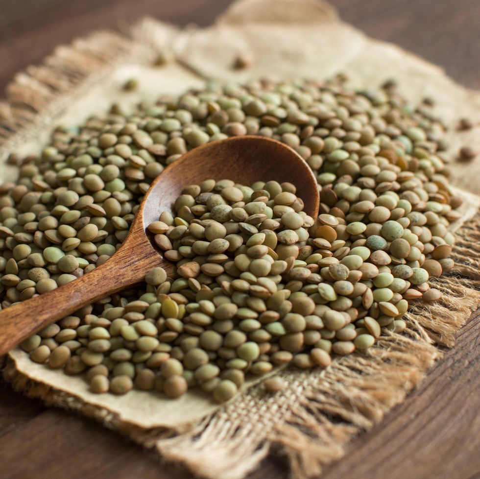 Green lentils with a spoon