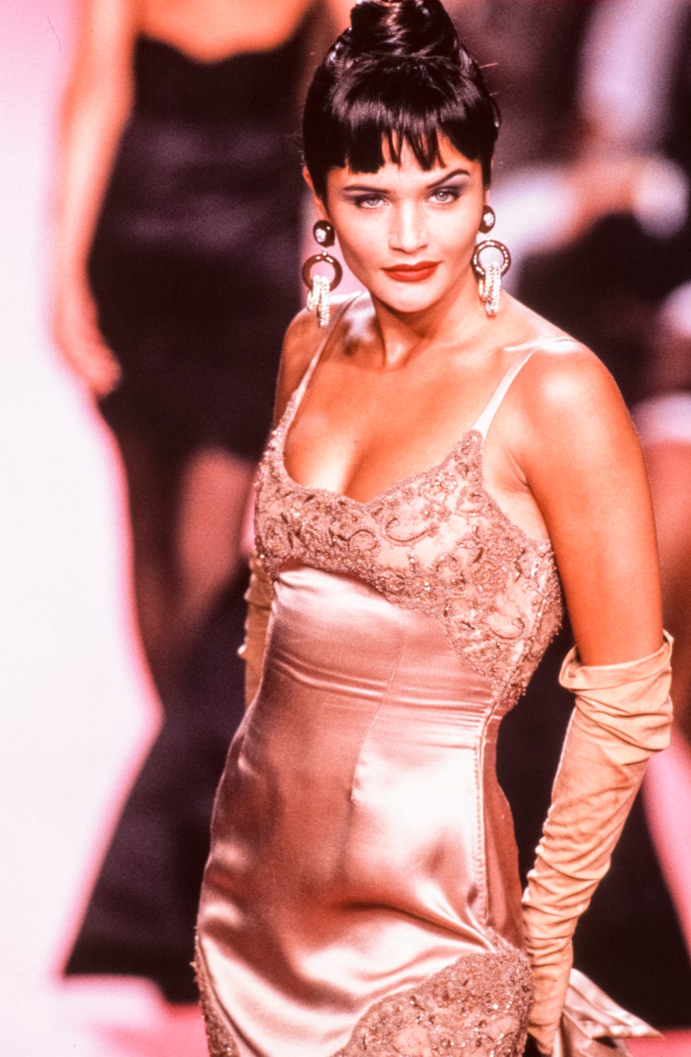 Helena Christensen walks the runway at the Valentino Haute Couture Fall/Winter 1991-1992