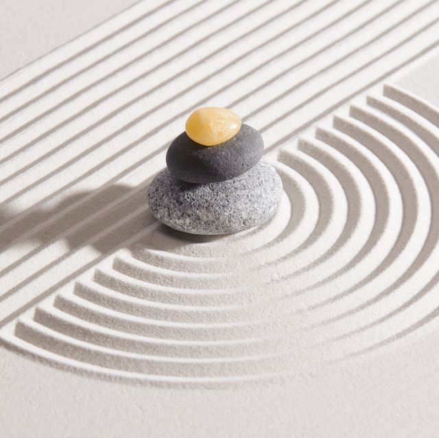 japan garden with stone of meditation in raked sand